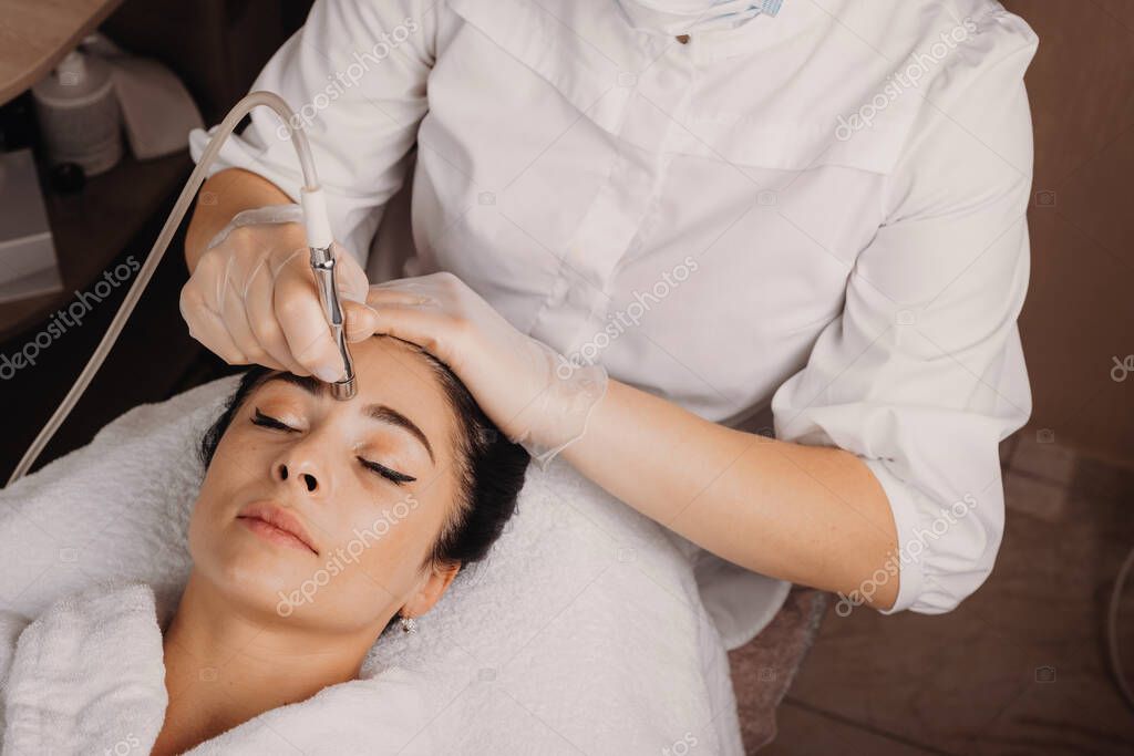 Esthetician performing a facial